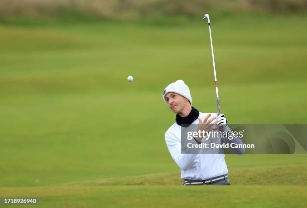 Matthew Goode of England the British actor encounters trouble escaping a fairway bunker on teh 16th hole as he plays his second shot on the 16th hole...