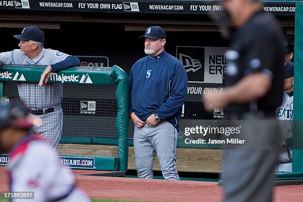 Manager Eric Wedge of the Seattle Mariners watches from the dugout during the game against the Cleveland Indians at Progressive Field on May 17, 2013...