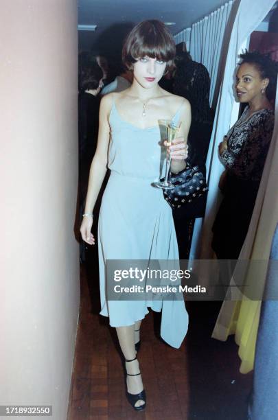 Milla Jovovich and guest attend the second-anniversary party for "George" magazine at Asia de Cuba in New York City on November 5, 1997.