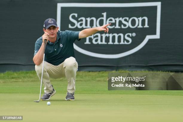 Henrik Norlander of Sweden lines up a putt on the 18th green during the first round of the Sanderson Farms Championship at The Country Club of...