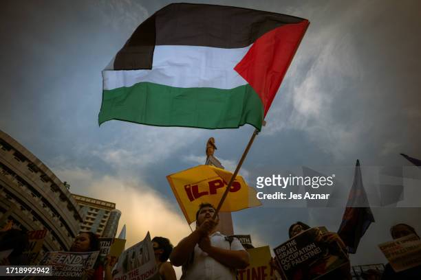 Pro-Palestinian protesters gather in support of the Palestinian people during a rally for Gaza on October 11, 2023 in Manila, Philippines. Protesters...