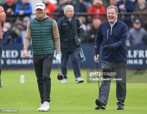 Gareth Bale of Wales the former international soccer player walks off the first tee with Piers Morgan the media personality during the first round of...