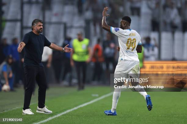 Chancel Mbemba Mangulu of Olympique De Marseille celebrates with Gennaro Gattuso Head coach of Olympique De Marseille after scoring to give the side...