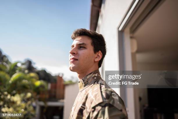 army soldier contemplating outdoors - military uniform stock pictures, royalty-free photos & images