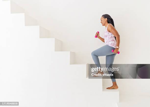 fit woman working out on stairs - cardiovascular exercise stock pictures, royalty-free photos & images