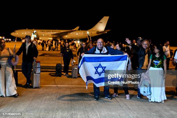 Brazilians land in Brazil on Wednesday, October 11, 2023 on the first Brazilian Air Force flight from Israel with 210 repatriated Brazilians, after...