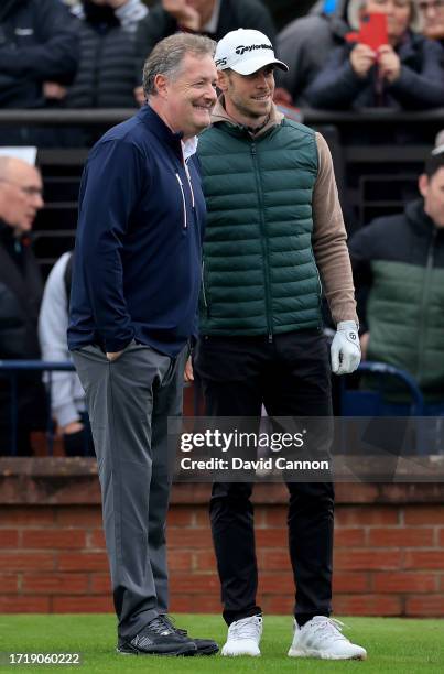 Gareth Bale of Wales the former international soccer poses for a picture on the first tee with Piers Morgan the media personality during the first...