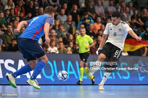 Gabriel Francisco de Oliveira Costa of Germany challenges Martin Smericka of Slovakia during the FIFA Futsal World Championship Qualifier match...