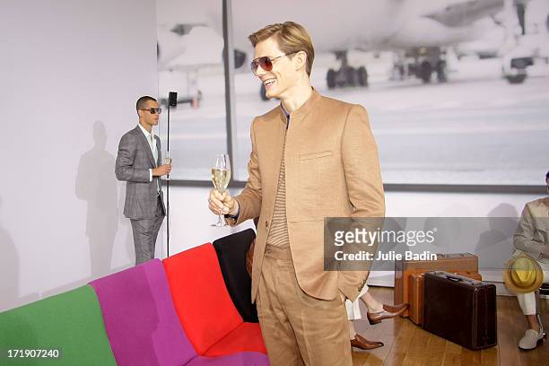 Models drink during the Francesco Smalto Menswear Spring/Summer 2014 Show As Part Of The Paris Fashion Week on June 29, 2013 in Paris, France.