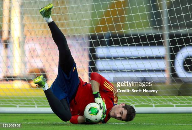 Iker Casillas of Spain makes a save during a training session, ahead of their FIFA Confederations Cup Brazil 2013 Final match against Brazil, at the...
