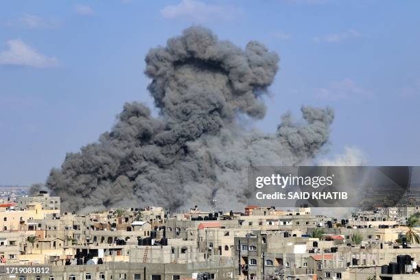 Smoke billows during an Israeli air strike in Rafah in the southern Gaza Strip on October 11, 2023. Israel declared war on Hamas on October 8...