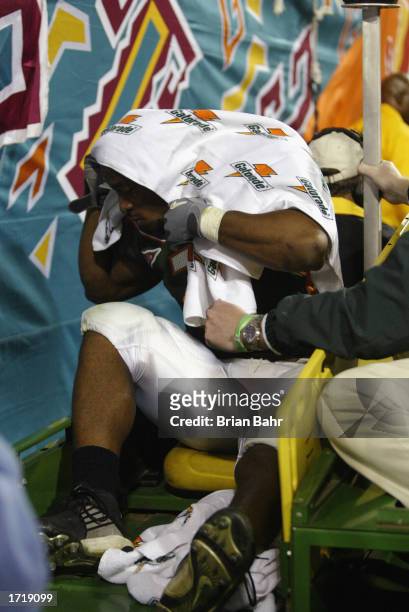 Running back Willis McGahee of the University of Miami Hurricanes is carted off the field after tearing ligaments in his knee during the BCS...