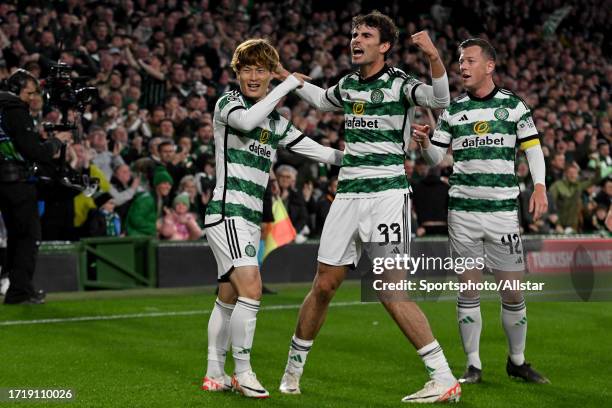 Kyogo Furuhashi,Matt O'Riley and Callum McGregor of Celtic celebrate during the UEFA Champions League match between Celtic FC and SS Lazio at Celtic...