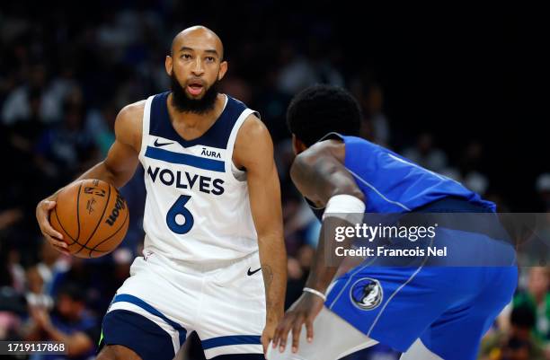 Jordan McLaughlin of Minnesota Timberwolves controls the ball during the NBA match between Dallas Mavericks and Minnesota Timberwolves at Etihad...