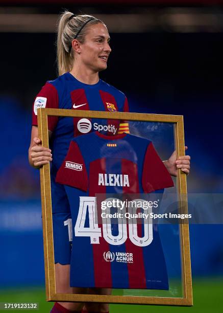 Alexia Putellas of FC Barcelona is presented with a commemorative shirt to mark her 400th matches with FC Barcelona ahead the Liga F match between FC...