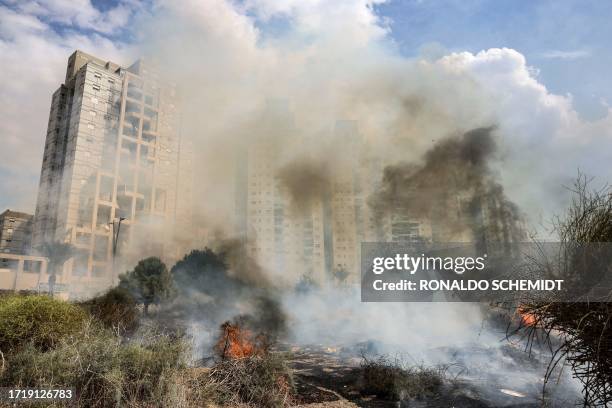 Smoke billows from a fire that broke out after a rocket attack from Gaza in the southern Israeli city of Ashkelon, on October 11, 2023. Thousands...