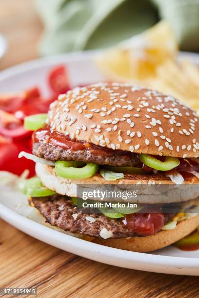 fat hamburger with french fries - double cheeseburger meal stock pictures, royalty-free photos & images