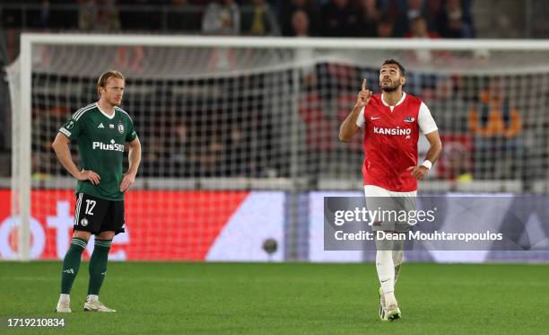 Radovan Pankov of Legia Warszawa looks dejected as Evangelos Pavlidis of AZ Alkmaar celebrates after scoring the team's first goal during the UEFA...