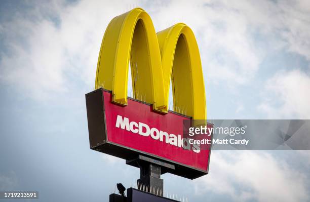 The sun shines on the Golden Arches and Drive Thru logo of the fast food restaurant McDonald's, on October 01, 2023 in Bristol, England. Founded in...
