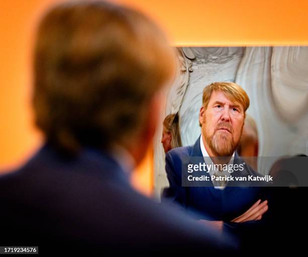 King Willem-Alexander of The Netherlands is photographed while looking at the work of Ricardo van Eyk during the Royal Prize for Free Art award...