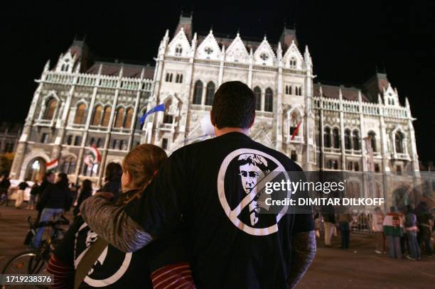 Hungarian protestors wearing t-shirts protesting against Hungarian socialist Prime Minister Ferenc Gyurcsany as a few thousand people protest in...