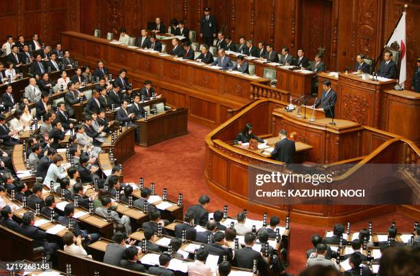 Japan's new Prime Minister Shinzo Abe delivers his first policy speech to members of the House of Representatives at the Diet in Tokyo, 29 September...