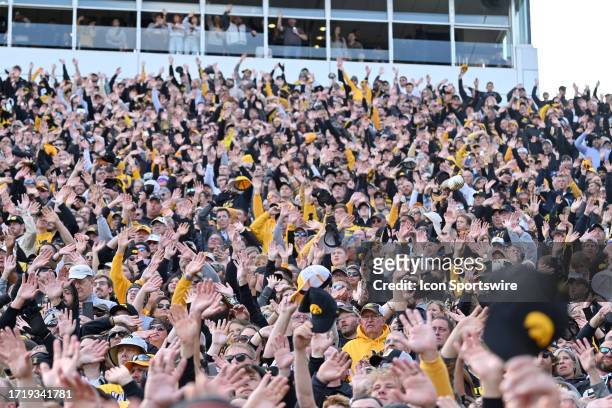 Fans wave to the patients at the Steadman Children's Hospital during a college football game between the Purdue Boilermakers and the Iowa Hawkeyes on...