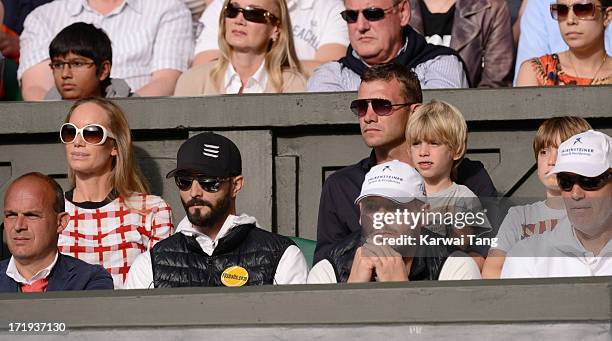 Kristen Pazik and Andriy Schevchenko attend the Novak Djokovic vs Jeremy Chardy match on Day 6 of the Wimbledon Lawn Tennis Championships at the All...