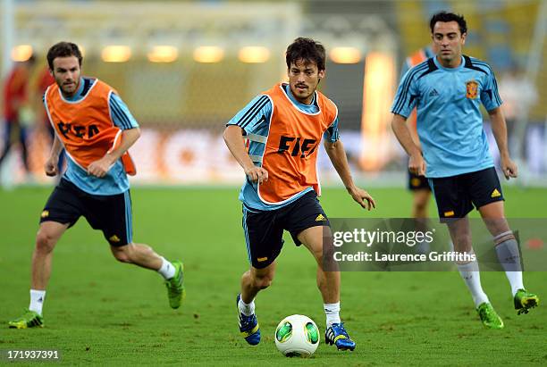 Juan Mata, David Silva and Xavi Hernandez of Spain in action during a training session, ahead of their FIFA Confederations Cup Brazil 2013 Final...