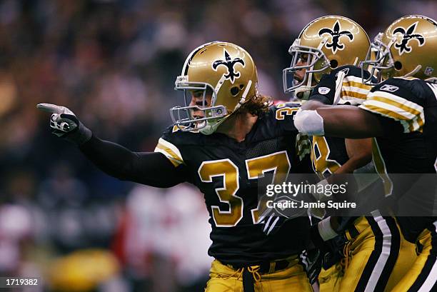 Steve Gleason of the New Orleans Saints celebrates a tackle against the Tampa Bay Buccanneers during the first half of the game on December 1, 2002...