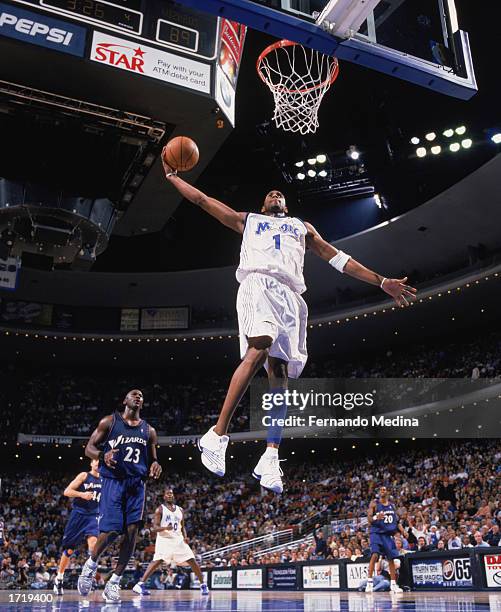 Tracy McGrady of the Orlando Magic follows through on his slam dunk News  Photo - Getty Images