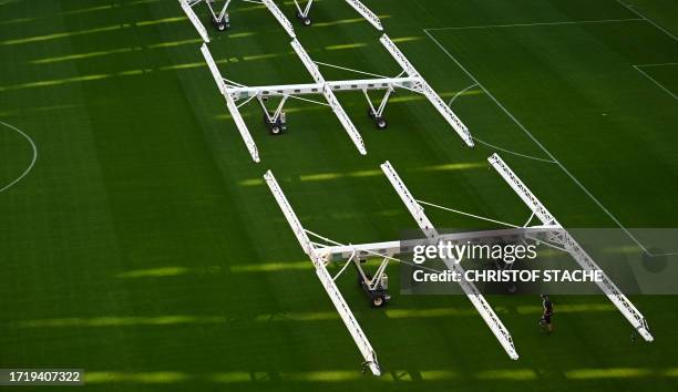 Machines for the regeneration of the football pitch are set up at the Allianz Arena Stadium, home stadium of German first division football club FC...