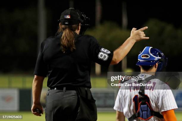 Home plate umpire Jen Pawol calls a strike from behind home plate during the game between the Scottsdale Scorpions and the Glendale Desert Dogs at...