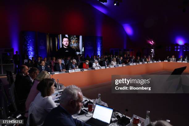 Volodymyr Zelenskiy, Ukraine's president, appears via video link during a roundtable at the annual meetings of the International Monetary Fund and...