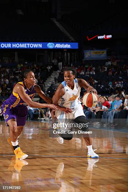 Epiphanny Prince of the Chicago Sky drives against A'dia Mathies of the Los Angeles Sparks during the game on June 29, 2013 at the Allstate Arena in...