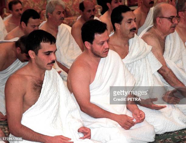 Jordanian leaders , Prince Ali, King Abdallah II, head of the royal court Abdel Karim Kabariti and former prime minister Modar Badran pray they...