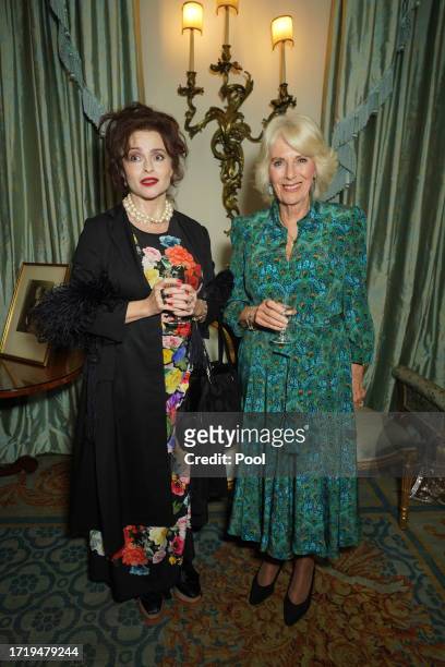 Queen Camilla and Helena Bonham Carter during a reception celebrating 30 years of the Forward Arts Foundation at Clarence House on October 11, 2023...