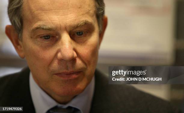 Britain's Prime Minister Tony Blair attends a discussion at a Reed in Partnership office in London, 05 March 2007, after meeting with long term...