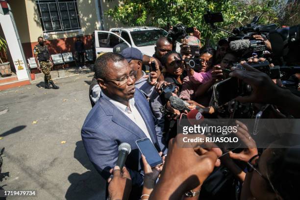 Siteny Randrianasoloniaiko, one of the 11 opposition candidates in Madagascar, speaks to the press after a meeting with the magistrates of the HCC in...