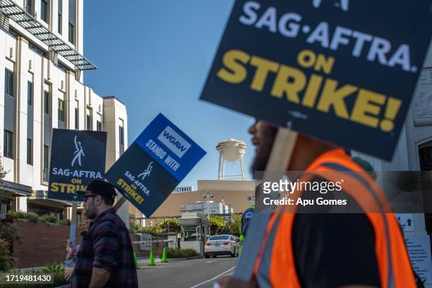 Workers walking in a SAG-AFTRA picket line at the Sony Pictures Studios, on October 11, 2023 in Culver City, California. The WGA has reached a deal...