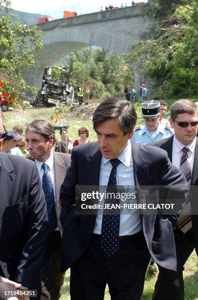 French Prime Minister François Fillon arrives, 22 July 2007 in Vizille, where a coach carrying Polish pilgrims earlier today skidded and fell down a...