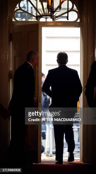 Photo dated 11 May 2007 shows British Prime Minister Tony Blair walking out of the front door of number 10 Downing Street to meet with Iraq's...