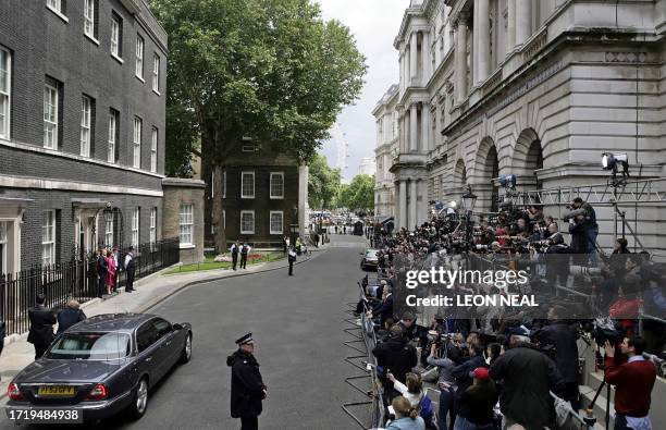 Outgoing British Prime Minister Tony Blair and his family bid farewell to the media as they prepare to leave 10 Downing Street, in central London, 27...