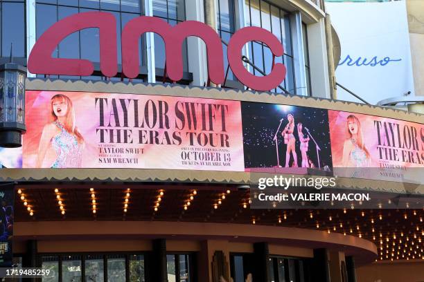 The AMC The Grove theatre marquee is pictured ahead of the "Taylor Swift: The Eras Tour" concert movie world premiere in Los Angeles, California on...