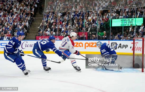 Jake Evans of the Montreal Canadiens scores a goal during the first period against the Toronto Maple Leafs at the Scotiabank Arena on October 11,...