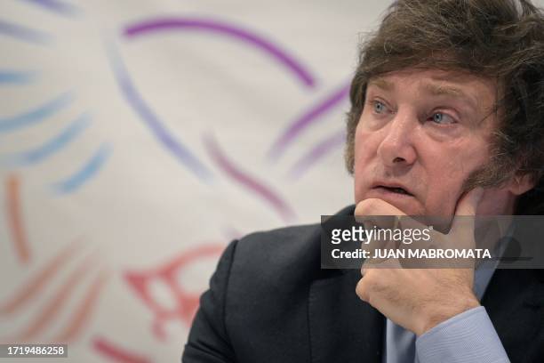 Lawmaker and presidential candidate for La Libertad Avanza party, Javier Milei, gestures during a press conference in Buenos Aires on October 11...