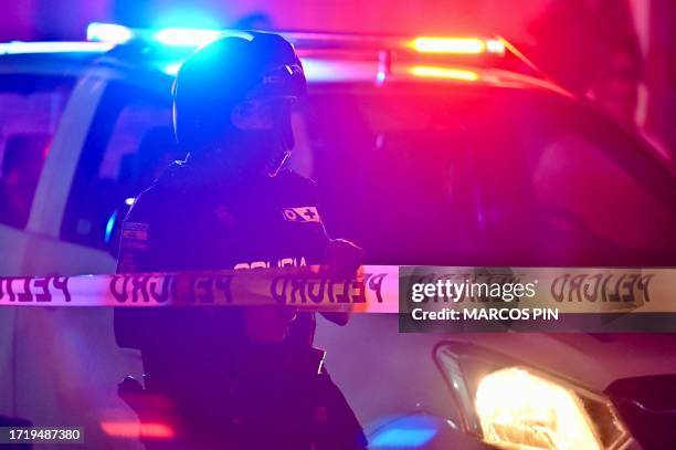 Policeman guards the scene of a murder in Guayaquil, Guayas Province, Ecuador, on October 8, 2023. Guayaquil, a major port city in south-western...