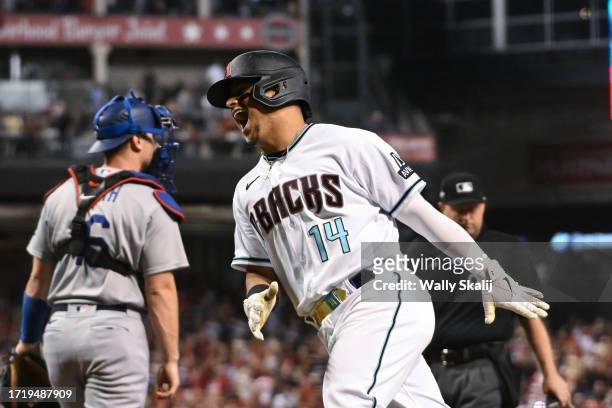 October 11: Arizona Diamondbacks Gabriel Moreno cheers as he rounds the bases after hitting a home run off of Los Angeles Dodgers Lance Lynn during...