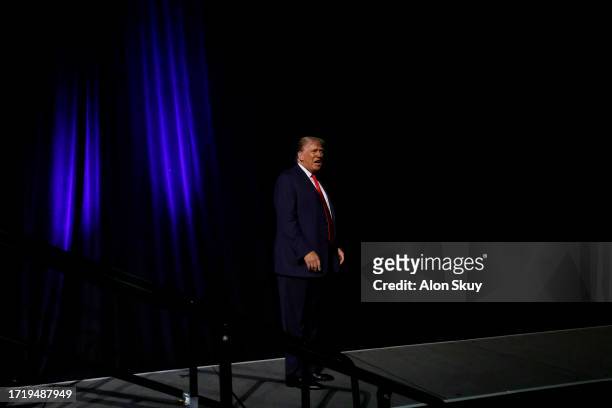 Former U.S. President Donald Trump leaves after delivering remarks at a rally hosted by Club 47 USA at the Palm Beach County Convention Center on...