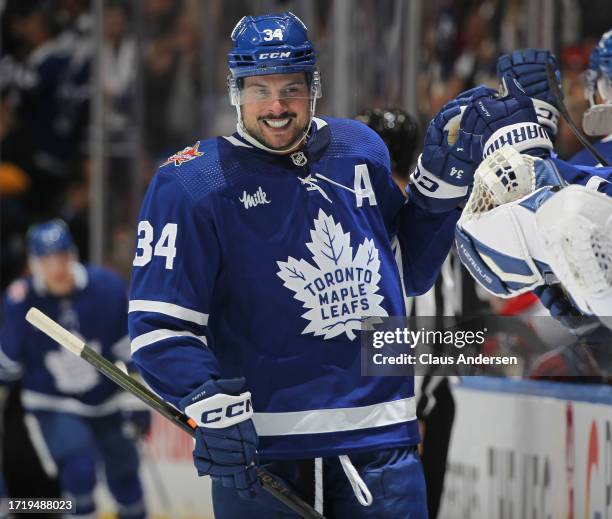 Auston Matthews of the Toronto Maple Leafs celebrates his third goal of the game in the third period against the Montreal Canadiens during an NHL...